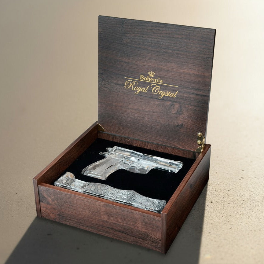Decorative gun-shaped crystal in a wooden box with 'Royal Crystal' branding.